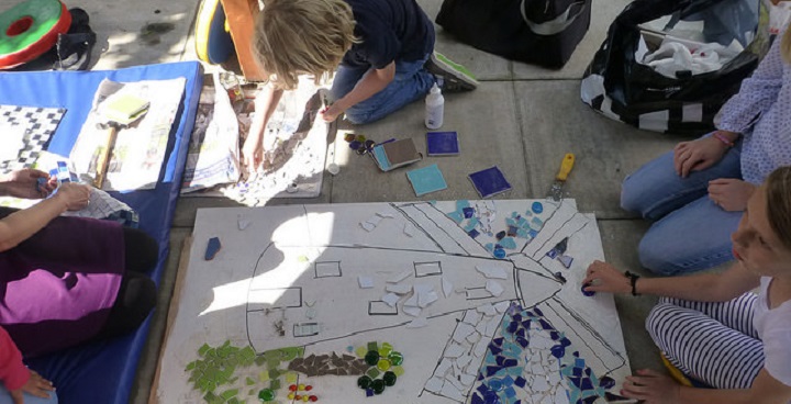 Art in the Park - children making a mosaic of the windmill