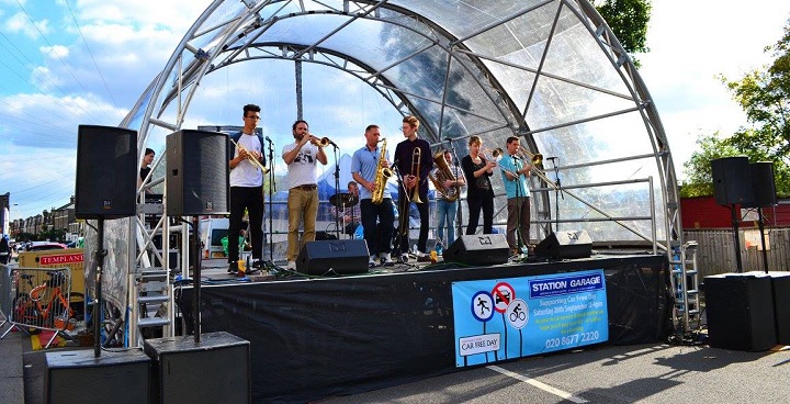 Image of a band playing on a stage, taken at last year's Car Free Day