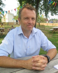 Photo of La Retraite headteacher Dominic Malins