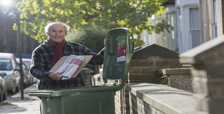 STreet Champion Michael uses new green wheelie bin to recycle card and paper