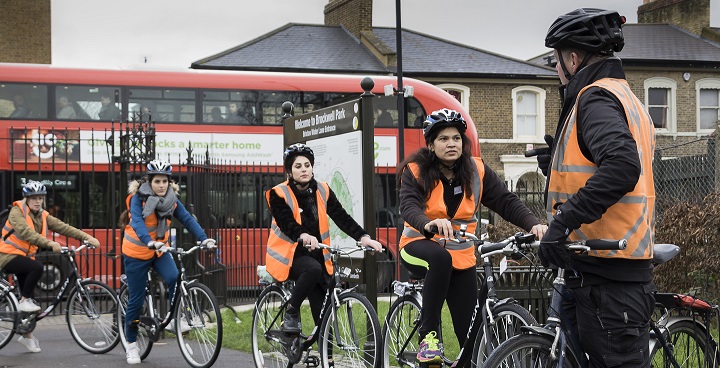 Participants in Sustrans' Bike It You Can Too scheme receiving instructions before cycling through Brockwell Park