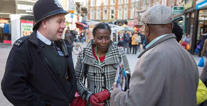 Cllr Jennifer Brathwaite speaking to local residents, traders and a police officer in Electric Avenue