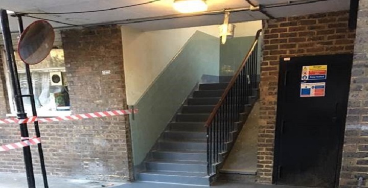 Stairwell and landing in Brixton estate with new blue urine-resistant coatings applied to floors and steps