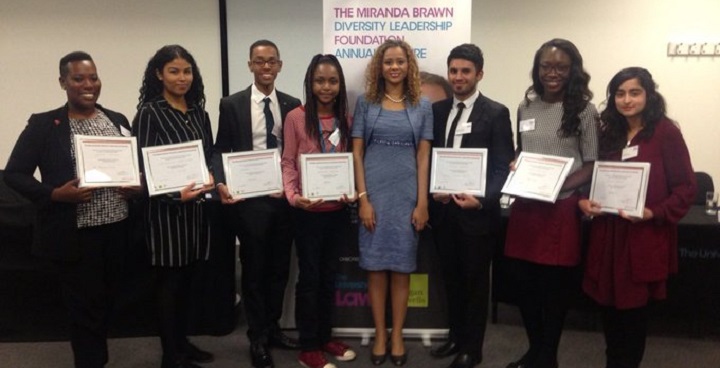 Miranda Brawn standing with scholarship students