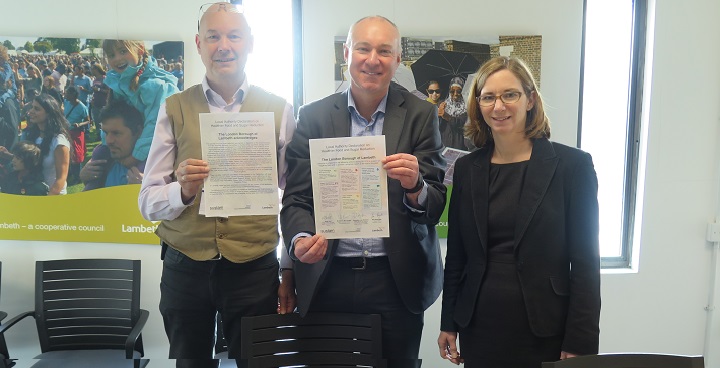 Cllr Jim Dickson, Dr Adrian McLachlan and Dr Ruth Hutt holding up the signed declaration