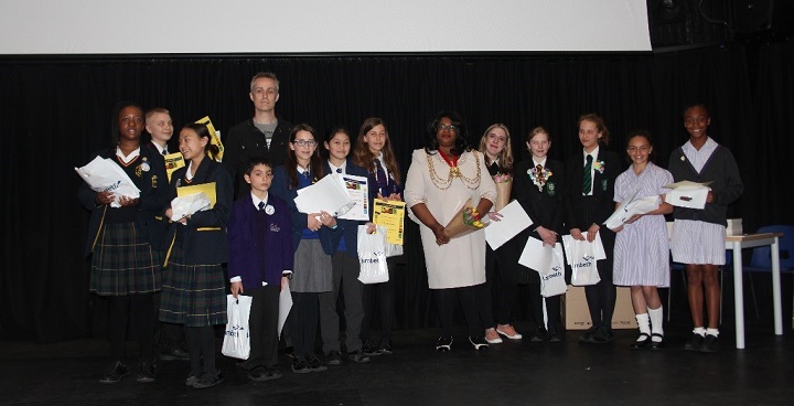Lambeth young people, the Mayor of Lambeth and author Dan Smith on stage at the Lambeth Phoenix Book Awards