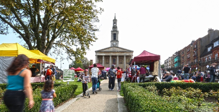 adults walking towards Victorian building in West Norwood