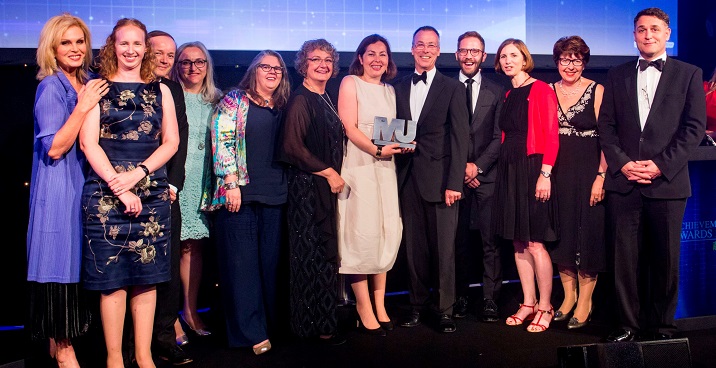 Public health colleagues on stage with Joanna Lumley to collect their award at the MJ awards ceremony