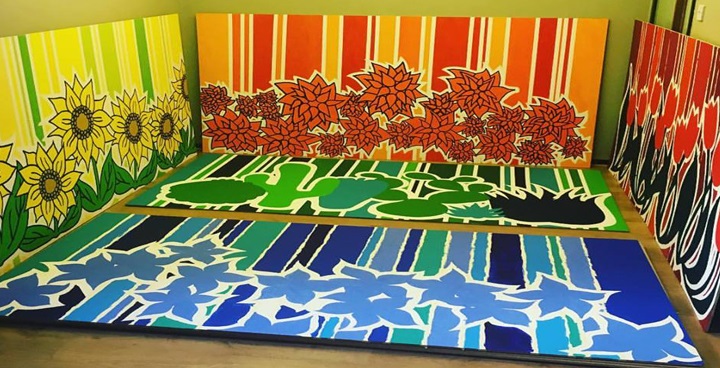 red, yellow, and green panels of plants and flowers on a background of stripes - designed by Cool-it Childrens's Art project