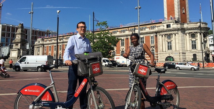 Cllr Jennifer Brathwaite and Will Norman, London's Walking and Cycling Commissioner posing with Santander bicycles in front of the Town Hall