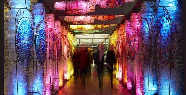 Lumiere Londn 2016 visitors walk through coloured light installation on the streets