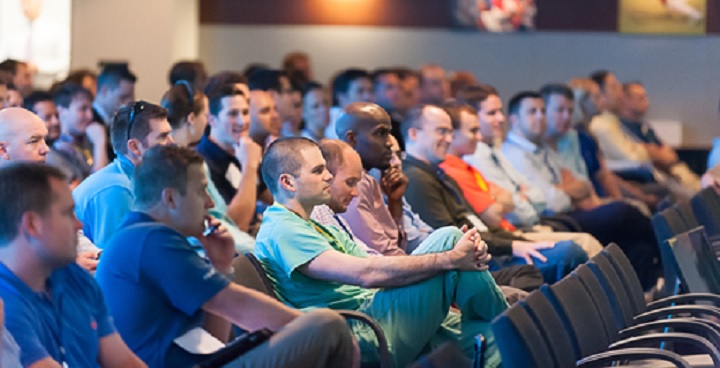 Rows of people sitting in a meeting