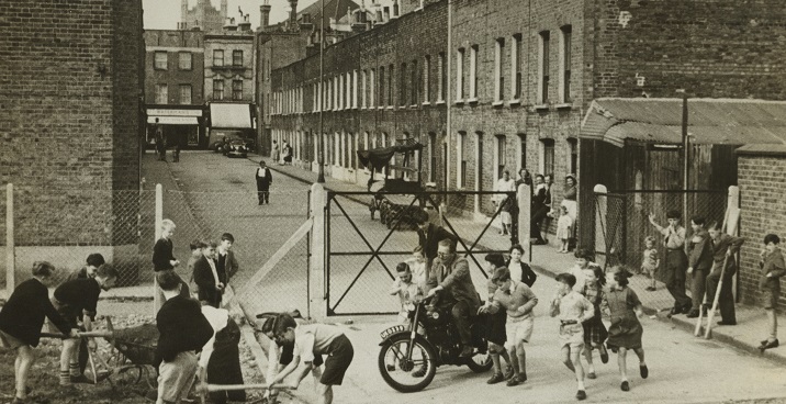 An image showing Lollard Adventure Playground, with children and adults playing.