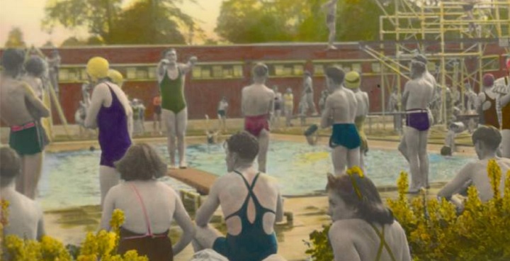 Lambeth Archives photo of 20+ people at Brockwell Lido, plants, water, sky and swimsuits hand tinted, skin mostly grey (unretouched)