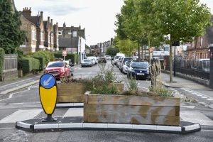 General view of the new closure, crossing and planters at Greyhound Lane/Estreham Road Junction, Streatham Common