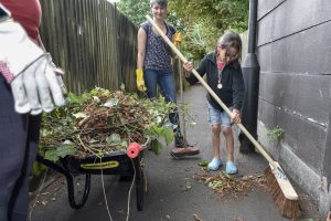 Volunteers taking part in a Community Freshview event organised by residents near Russell's Footpath, Streatham, with materials, tools and a skip provided by London Borough of Lambeth, in order to cut back vegetation, build flower boxes and clean up the area in general