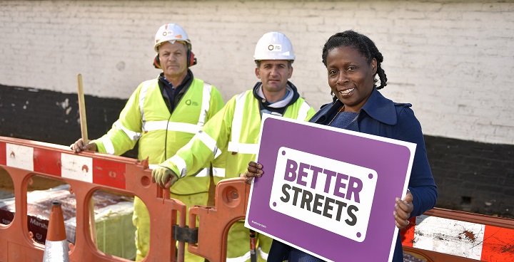 Here's workers (L-R) Gregor Paschka and George Irsu with Cllr Jennifer Brathwaite.