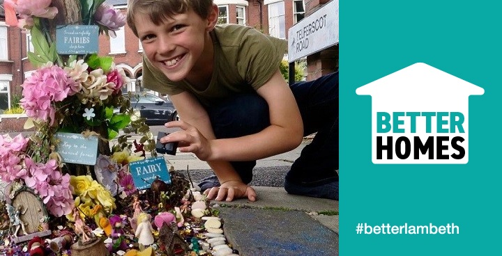 the fairy garden features seashells, wooden signs, tiny fairies and stands in the middle of the pavement where children (and grown ups) take care of it and add to it