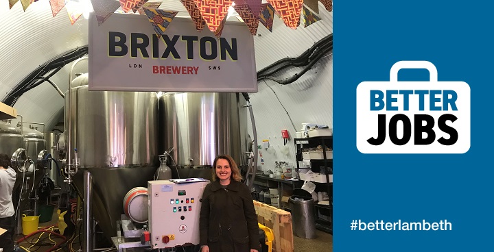 Xochitl Benjamin, Co-founder of Brixton Brewery` standing in front of two large stills.