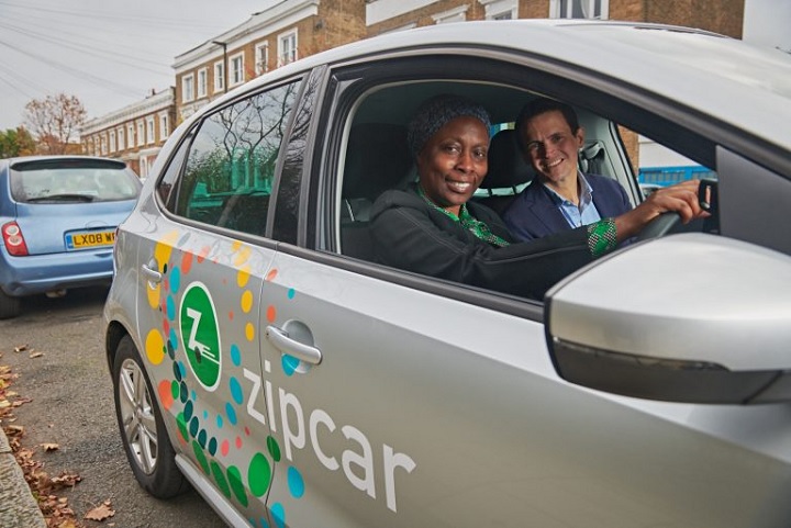 Zipcar Flex launch in Lambeth. Jonathan Hampson, general Manager, Zipcar UK shows Cllr Brathwaite from Lambeth council the new Zipcar flex car which can be droped off anywhere in else in london that is in zipcars flex blue zone.