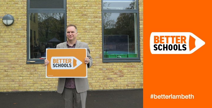 Jon Juckes, Teacher at Lansdowne School, holding the 'Better Schools' sign