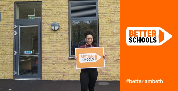 Doctor Who star Pearl Mackie stood in front of the new Lansdowne School building holding a Better Schools sign