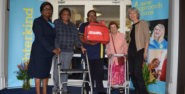 Image showing Cllr Meldrum with staff and residents of a Lambeth care home posing with the red bag