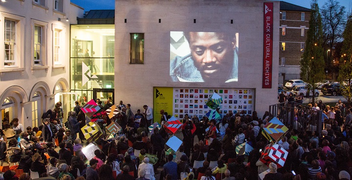 London, UK. 9th Apr, 2017. Darcus Howe face is projected on the Black Cultural Archives Building as over a thousand people gathered to remember the civil rights activist. Darcus Howe, who campaigned for black rights for more than 50 years, has died. He was 74. Credit: Thabo Jaiyesimi/Alamy Live News