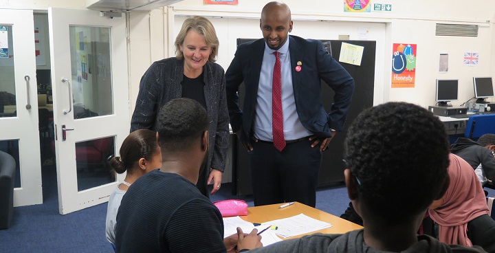 Cllr Peck pictured speaking with children during a visit to the Bright Education Centre