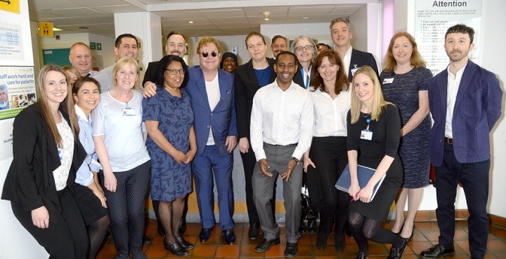 Staff from Kings College Hospital and other authorities in the partnership pose for a photo with Elton John