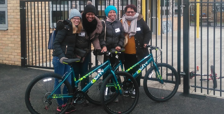 Adult learners who've completed a bike-it cycling training course show off their new pushbikes