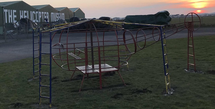 Vintage helicopter climbing frame in its new home outside the aircraft hangars of the Helicopter Museum