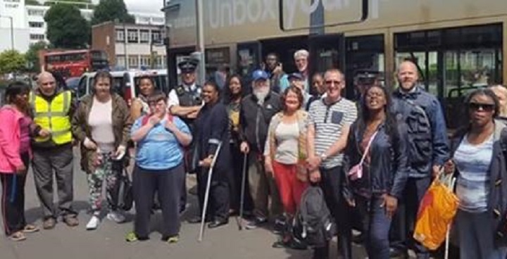 Big Bus Day with group of people standing by double decker bus