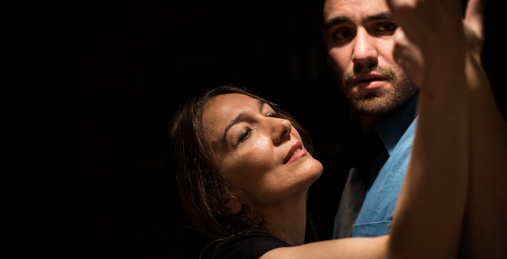 actress with arm lifted in a circle round actor's face - rehearsing for a new production of Lorca's 'Blood Wedding' at Clapham Omnibus Sept. 2018