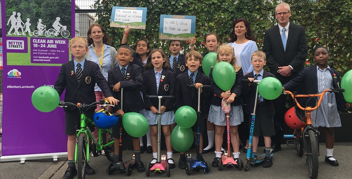 Cllr Claire Holland, headteacher Robert Coyle and parent Bernie Leyland with children from Corpus Christi in front of their new green screen