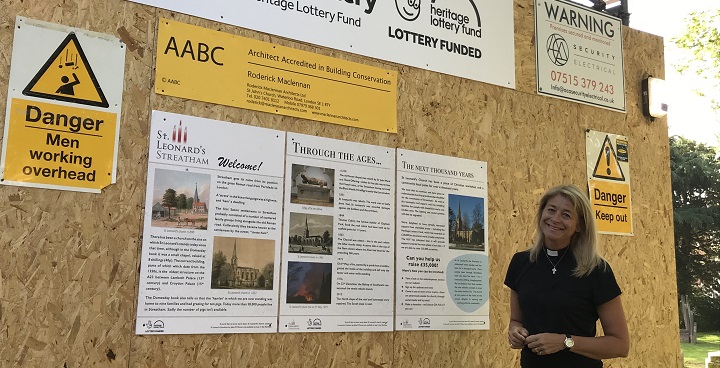 Canon Anna Norman-Walker, rector at St Leonard’s, Streatham with the plan board for restoration