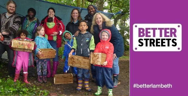 Experts, children & parents hold boxes in Knights Hill Wood as part of the renewal & history project