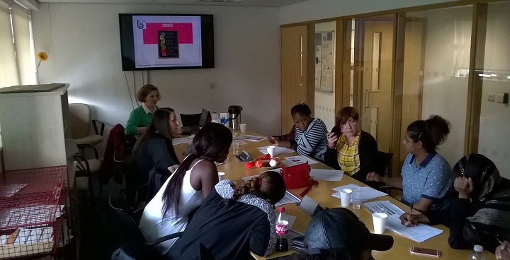 A group of tenants in a round-table discussion during the employability session with facilitator from Breyer Group