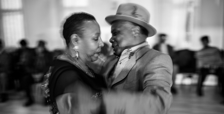Photo by Jim Grover of older couple dancing from the 'Windrush - portrait of a generation' exhibition