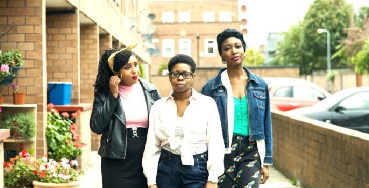 Three black girls pose for photo