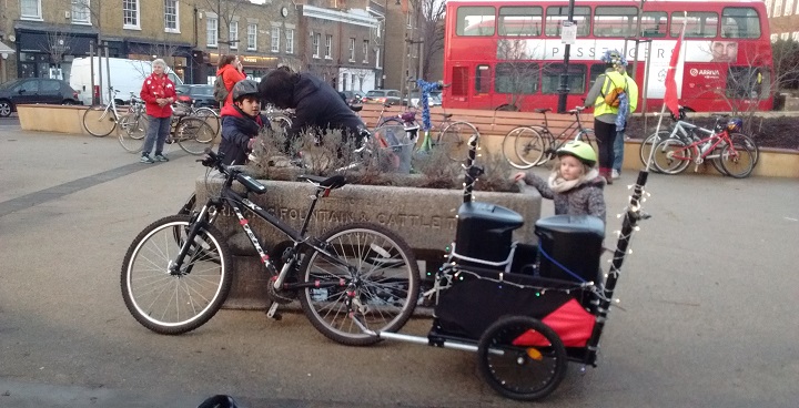 Black 2-wheeler pushbike with trolley box at back fitted with christmas lights * speakers for in-ride entertainment for children