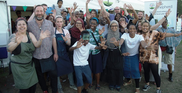 Outside a Tent at Lambeth Country show with stallholders who've been there to show off their new business start-ups celebrating. Colin Crooks of Tree Shepherd top right at back of pic (among the tall people)