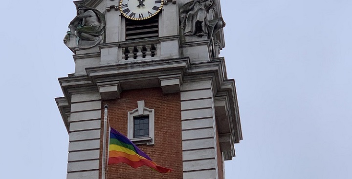 Gat Pride rainbow flag under the clock tower on Lambeth Town Hall