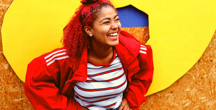 Girl in red jacket from We Rise crowdfunder 2019 page