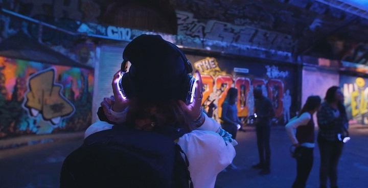 leake Street secret sunrise dancer in headphones