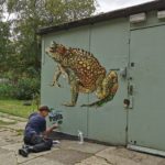 Artist AMT puts finishing touches to painting to celebrate pond restoration work in Lambeth park