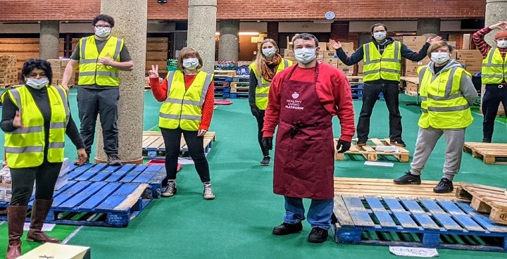 HFP volunteers with empty pallets in food distribution network