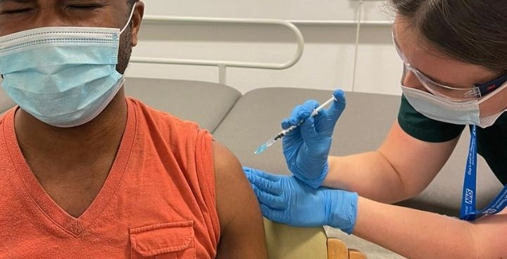 Lambeth Council staff member receiving his covid-9 vaccine
