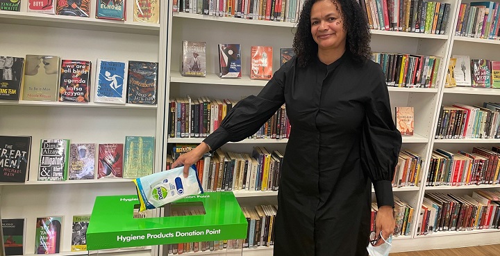 Librarian Abibat shows how to use the donation bins in Lambeth Libraries
