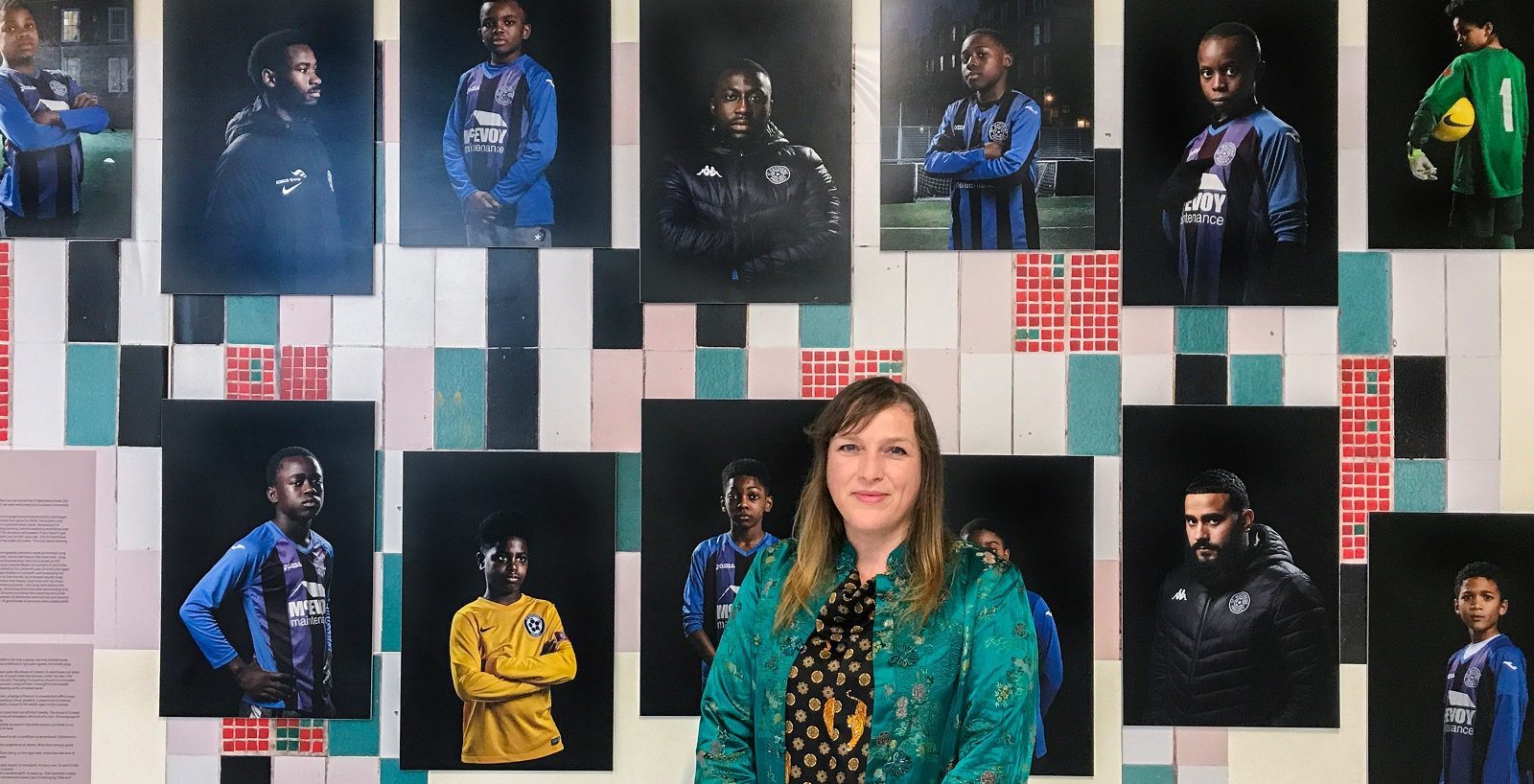 Photographer Ellie Laycock with her photos of St Matthews football coaching team representing 'leadership'